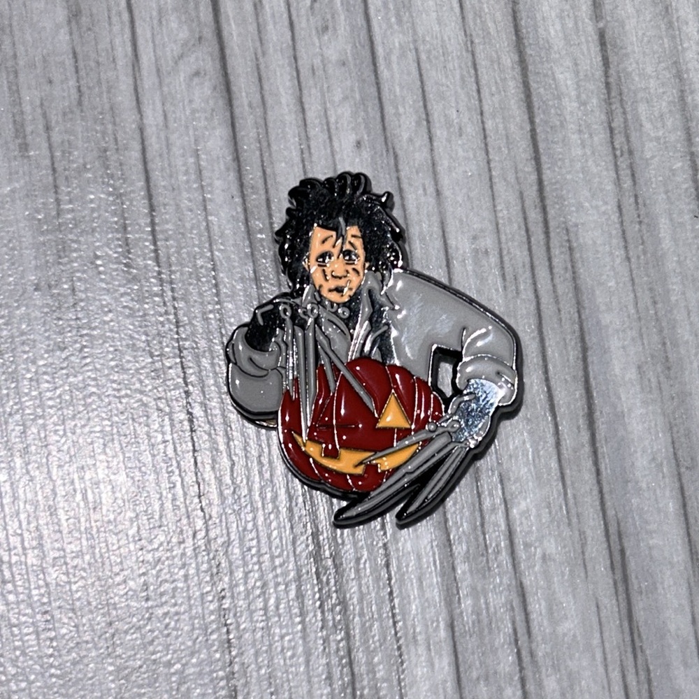 Edward scissor hands jack o lantern carving with his knife hands pumpkin pin